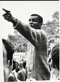 African American Man Points and Speaks