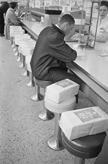 Oppression Prints: African American Man Staging Lunch Counter Sit-in