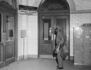 African American Soldier Reads Segregated Terminal Sign