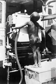 Partially Nude Prints: African Boy and an X-Ray Machine