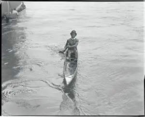 African Coin Diver and Entertainer Boating to Shore