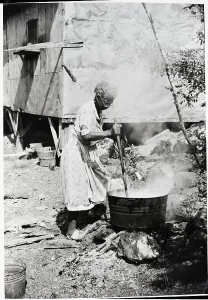Working Prints: African Am Woman Boils Laundry Over Fire