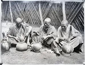 West Prints: Africans Seated Ornamenting Pottery