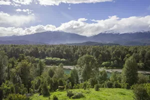 Chilean Lake District Collection: Agricultural land, forest and river, Cisnes, Region de Aysen, Chile