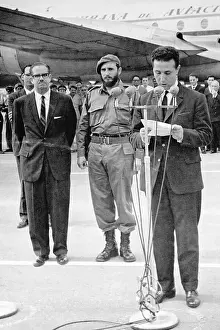 Ahmed Ben Bella Reading at Microphone