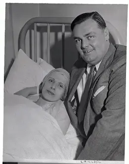 Aimee Semple McPherson Lying in Hospital Bed with Husband Nearby