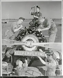 Air Corps Mechanics Working on Plane