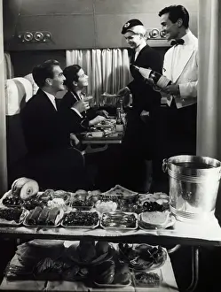 Passenger Airplane Prints: Air France Stewardess and Steward Serving Passengers