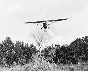 Airplane Dropping Cloud of Mosquito Insecticide