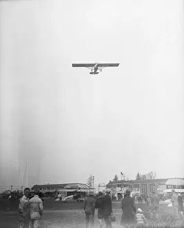 Airplane Being Observed Over Airfield