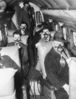 Oxygen Mask Prints: Airplane Passengers Wearing Oxygen Masks