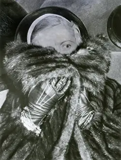 Hiding Prints: Al Capone's Wife Trying to Hide from Camera