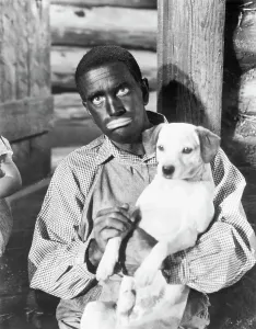 Racism Prints: Al Jolson in Black-Face Holding Dog