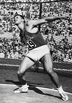 Discus Prints: Al Oerter Throwing Discus in Olympics