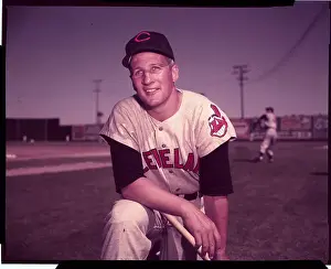 Al Rosen Bending Down on Baseball Field