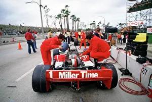 Prints of LONG BEACH, CALIFORNIA - MARCH 30 : Miller High Life teammates do final adjustments to Al Unser, Sr Legends of the Track: Al Unser Sr racecar at Long Beach Grand Prix race 1984