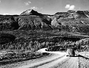 Prints of circa 1950: A car drives along the Alaska Highway between Yukon, Canada and Frairbanks, Alaska. (Photo by Evans/Three Lions/Getty Images) Three Lions Photo Agency Prints: Alaska Highway