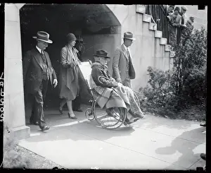 Albert B. Fall Sitting in Wheelchair with Escorts Nearby