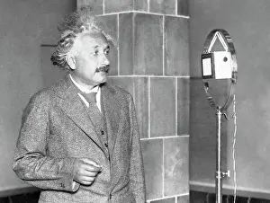 Prints of (Original Caption). Einstein congratulating the inventor of electric light...Professor Albert Einstein, famous German scientist, is seen above as he congratulated Thomas A A Glimpse into Genius: Albert Einstein Congratulating Thomas Edison via Radio