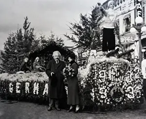 Prints of (Original Caption) 1/2/1932-CA- Dr A Glimpse into Genius: Albert Einstein Inspecting Winning Float