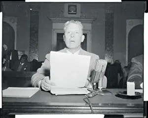 Albert Gore Sitting at a Table