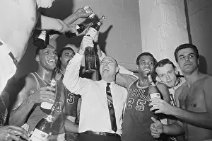 Alex Hannum and His Team Raising Champagne Bottles