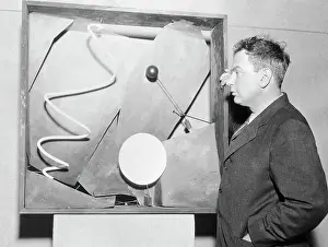 Alexander Calder Showing his Piece Black Frame