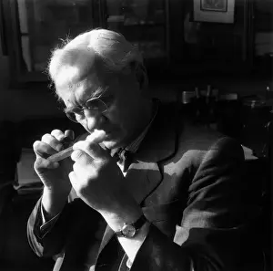 Prints of February 1951: Sir Alexander Fleming (1881 - 1955), discoverer in 1928 of the importance of penicillin, studing a test tube culture with a hand lens The Keystone Press Agency Collection Prints: Alexander Fleming