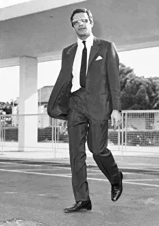 Alexander Onassis Walking Across Lot