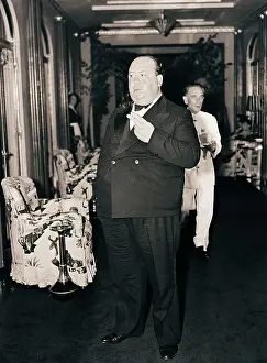 Hallway Prints: Alfred Hitchcock Smokes in Hallway