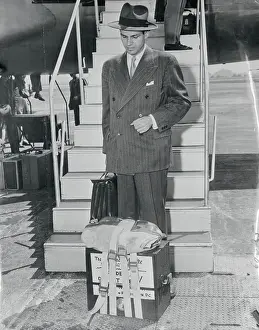 Alger Hiss Exiting Airplane with Case