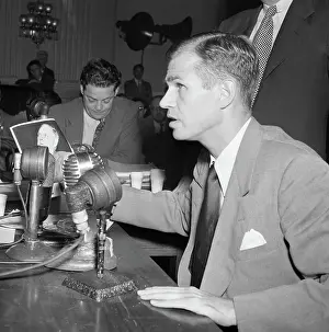 Department Prints: Alger Hiss Looking at Photos of Whittaker Chambers