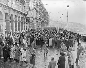 Algerian Prints: Algerians Marching in Rain on Street