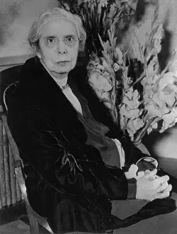 Feminism Prints: Alice Stone Blackwell Sitting by Flower Arrangement
