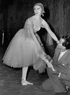 Alicia Markova Allowing Her Co Star to Adjust Shoes for Dance