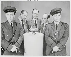 Guarding Prints: Alistair Cooke with Cellini Cup on Omnibus