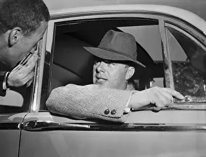 Aly Khan Speaking to a Reporter From His Car