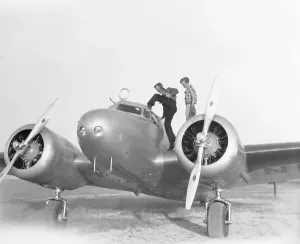 Navigator Prints: Amelia Earhart and Fred Noonan Entering Plane