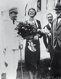 Prints of (Original Caption). Amelia Earhart in Rome. Rome, Italy: With the huge bouquet of roses in her arms, Mrs The Sky's Trailblazer: Amelia Earhart Holding Flowers