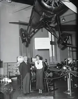 Amelia Earhart and Orville Wright Posing Near Displayed Airplane