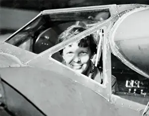 Amelia Earhart Peering out from Airplane