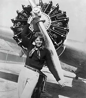 Amelia Earhart Posing Before Her Plane's Propeller