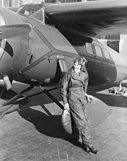 Amelia Earhart Shown With Her Airplane