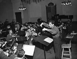 American Composer and Conductor Leonard Bernstein Directing Orchestra