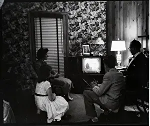 American Family at Home Watching Television