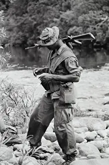 Balancing Prints: American GI Stepping Across Rocks
