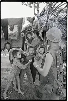 American Giving Gum To Vietnamese Kids
