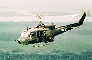 Bell Uh 1 Iroquois Prints: American Gunners Firing from Helicopter in Vietnam