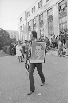American Indian Protester Holding Club and Nixon Portrait