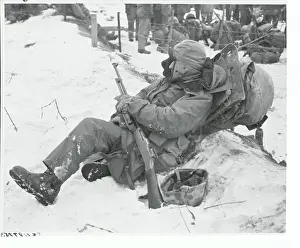 Patience Prints: American Marine Resting in the Snow near Fence